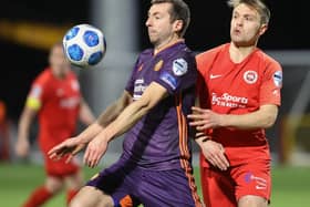 Portadown’s Stephen Murray and Larne’s Graham Kelly battle for the ball