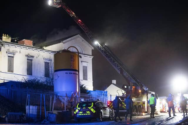 Firefighters battle a raging fire at the old Downe Hospital Site in Downpatrick, County Down - Credit Conor Kinahan/PACEMAKER PRESS