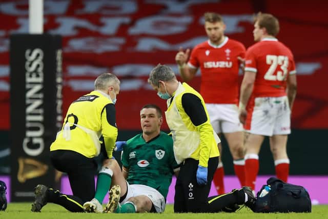Johnny Sexton of Ireland receives medical attention during the Guinness Six Nations match against Wales at the Principality Stadium. (Photo by David Rogers/Getty Images)