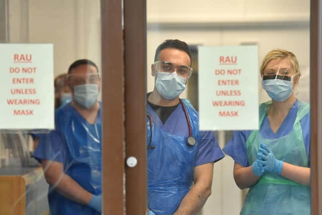 Medical staff prepare for the arrival of patients who have tested positive for Covid-19. (Photo: PA Wire)