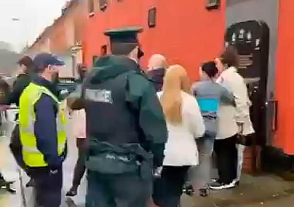 Police officers intervened at the memorial marking the 29th anniversary of a loyalist massacre at the Sean Graham's bookmakers. Pacemaker Belfast