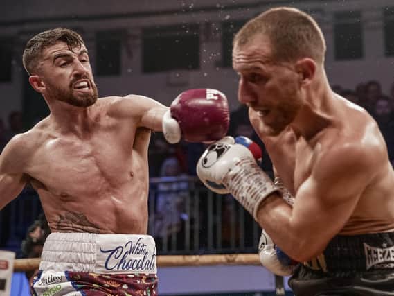 Tyrone McCullagh lands a shot on Ryan Walsh who inflicted the Derry southpaw's first professional loss last February.