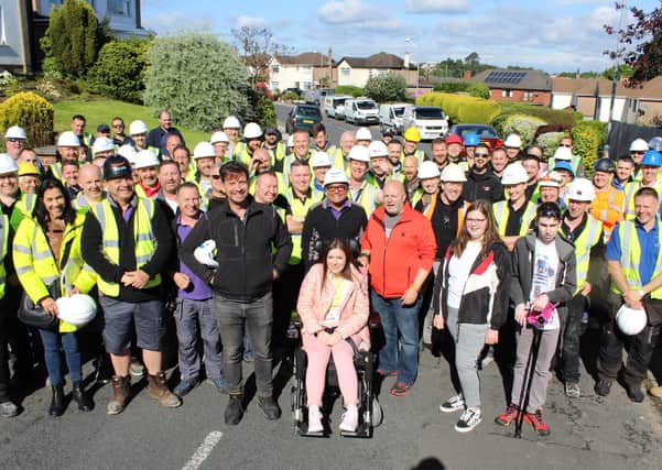 The DIY SOS team and volunteers with the McCreight family in Bangor