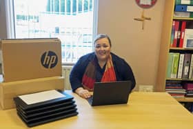 St Ronan’s College principal Fiona Kane with some of the laptops at the school in Lurgan