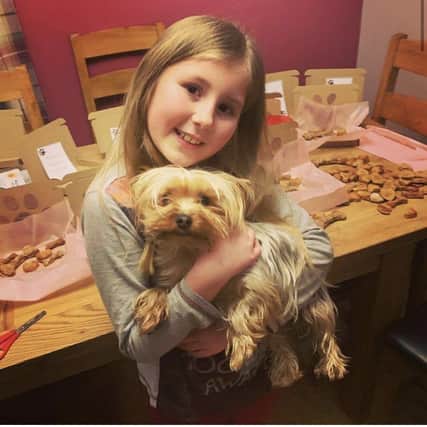 Khyia Douds has set up her own online dog biscuit business