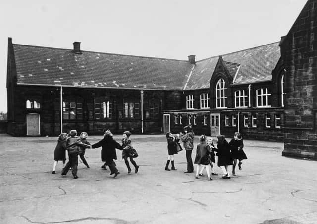Children playing in a school playground in England in the 1970s. Schools provide the socialisation, the stability and support that many children need, writes the former principal Hugh McCarthy