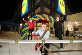 Pictured at the store opening are Lily Irvine (Edenbrooke Primary School), Thomas McFarlane (Lidl Northern Ireland Hillview Retail Park Store Manager) and Pearse Osborne (Holy Cross Boys Primary)