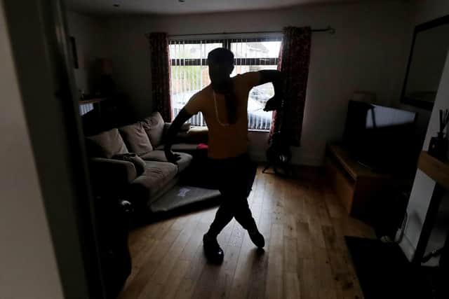 Cuthbert Tura Arutura teaches his Irish sean nos dance class via zoom at his Home in Ballygowan, Co Down. The Black Lives Matter campaigner, who is originally from Zimbabwe, is spending lockdown teaching online Irish dance classes