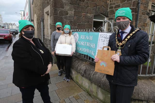 The Mayor of Causeway Coast and Glens Borough Council, Alderman Mark Fielding and his wife Phyllis join Reach volunteers Annette Ludlow and Jo Purcell at their Portrush base as they get ready to deliver food and essential items to those in need