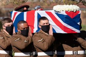 The coffin of Captain Sir Tom Moore is carried by members of the armed forces during his funeral at Bedford Crematorium on Saturday. Photo: Joe Giddens/PA Wire
