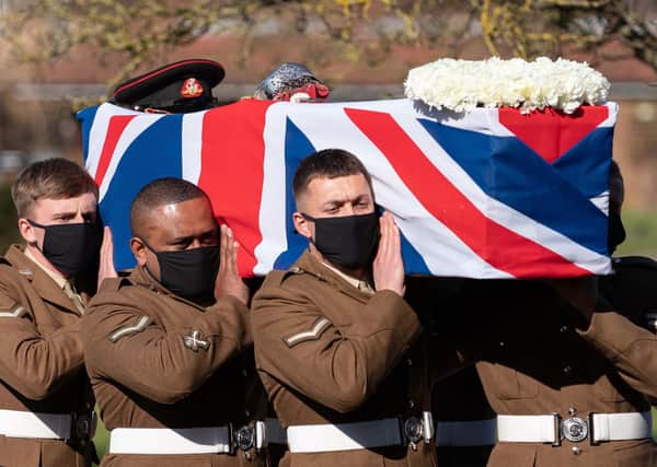 The coffin of Captain Sir Tom Moore is carried by members of the armed forces during his funeral at Bedford Crematorium on Saturday. Photo: Joe Giddens/PA Wire
