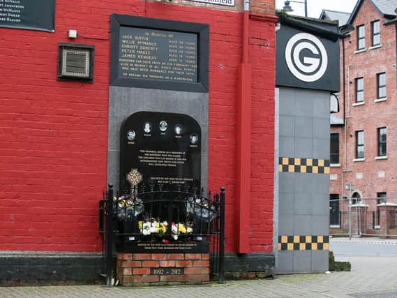 A memorial to the five people killed when two gunmen entered a bookmakers and open fire.