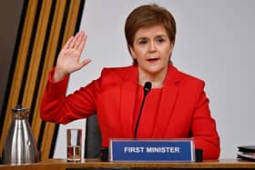 Scottish First Minister Nicola Sturgeon taking oath before giving evidence at Holyrood in Edinburgh