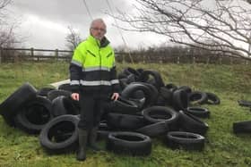 SDLP Cllr Eamon McNeill at the Birches where 250 tyres were dumped.