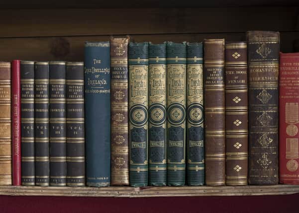 Books on bookshelves, part of the Library collections of the Earls of Enniskillen  at Florence Court, Co. Fermanagh, Northern Ireland.