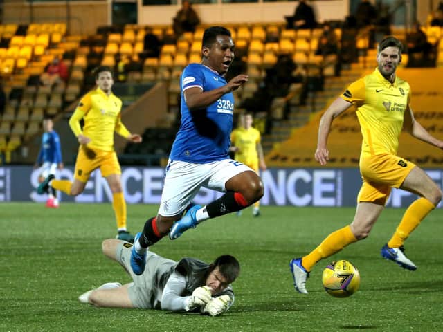 Rangers' Alfredo Morelos (top) before being shown a yellow card for diving