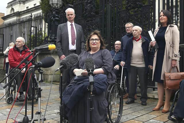 Jennifer McNern, who lost her legs in the Abercorn bomb, with other victims outside court last year in their bid to get the victim pension paid. Ben Lowry writes: "Barely anyone would dispute that a civilised society should provide generous, life-long care to such victims of appalling injury". But is a huge scheme that includes many lesser injuries appropriate at this time?
