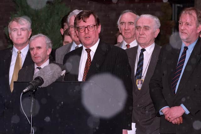 David Trimble fronts the UUP negotiating team as he addresses the media after the signing of the Good Friday Agreement in 1998