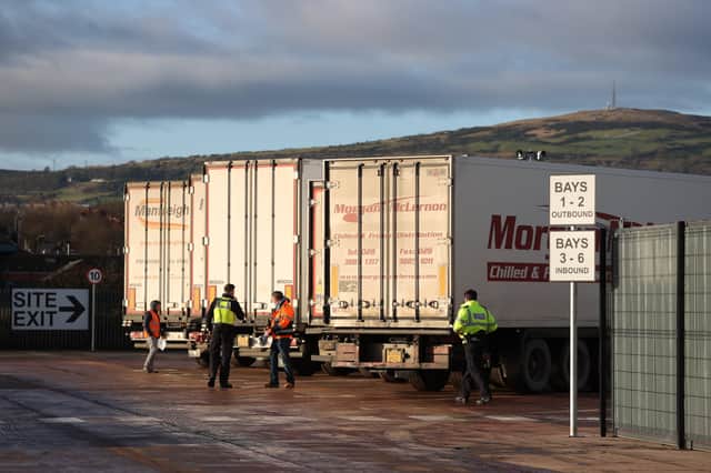 Border Force officers talk to lorry drivers at the DEARA site near Belfast Harbour for inspections