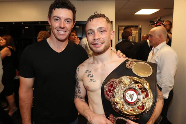 Two Northern Irish sporting greats from the younger generation, the golfer Rory McIlroy and the boxer Carl Frampton. In the background on the right is a former boxing champ from Ulster, Barry McGuigan