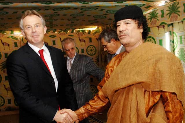 Former Prime Minister Tony Blair meeting late Libyan leader Colonel Muammar Gaddafi at his desert base outside Sirte south of Tripoli in 2011.
