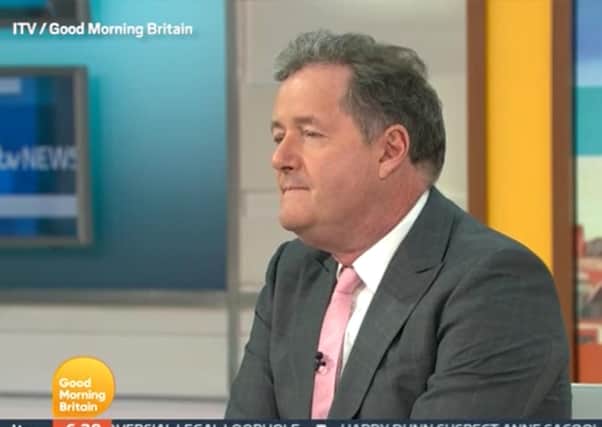 Video grab taken from ITV of presenter Piers Morgan during a Good Morning Britain discussion about the Duchess of Sussex with his colleague, Alex Beresford, the morning after the UK broadcast of the Duke and Duchess of Sussex interview with Oprah Winfrey.