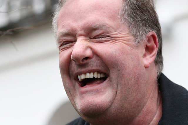 Piers Morgan laughs as he speaks to reporters outside his home in Kensington, central London, the morning after it was announced by broadcaster ITV that he was leaving as a host of Good Morning Britain