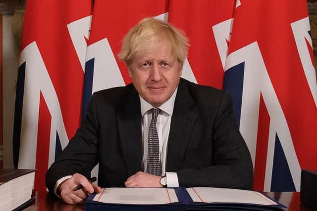 Boris Johnson in December signs the Brexit deal that included an Irish Sea border. Ban Habib says that the prime minister talked like Winston Churchill, but acted like Neville Chamberlain