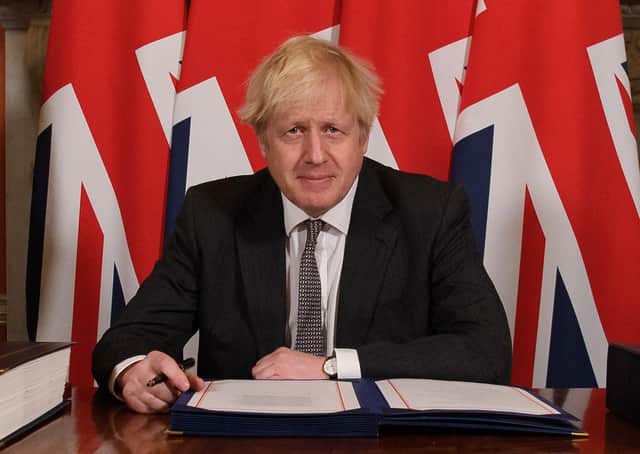 Boris Johnson in December signs the Brexit deal that included an Irish Sea border. Ban Habib says that the prime minister talked like Winston Churchill, but acted like Neville Chamberlain