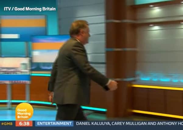 Presenter Piers Morgan storms out of Good Morning Britain on Tuesday after being criticised for saying he did not believe Meghan in a discussion with his colleague, Alex Beresford. Photo: ITV/PA Wire