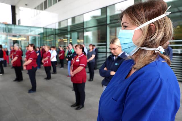 Staff at the Royal Victoria Hospital, Belfast last year observing a minute's silence in honour healthcare staff who have died during the Coronavirus pandemic. Picture: Stephen Davison/Pacemaker