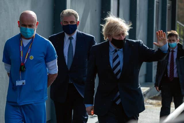 Prime Minister Boris Johnson is accompanied by the Secretary of State for Northern Ireland, Brandon Lewis, while visiting county Fermanagh on Friday.