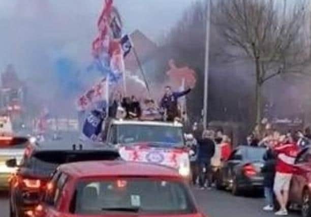 Rangers fans on the Shankill Road celebrate their team winning the Scottish Premiership earlier this month. Critics accused them of breaching Covid rules