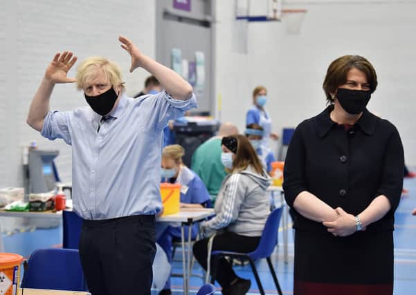 Prime Minister Boris Johnson with First Minister Arlene Foster during a visit to the Lakeland Forum vaccination centre in Enniskillen on Friday