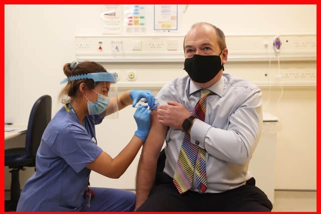 Northern Ireland Chief Medical Officer Michael McBride receives his second dose of the Oxford/AstraZeneca coronavirus vaccine from nurse Alana McCaffery at the Ulster Hospital Covid-19 vaccination centre in Belfast.