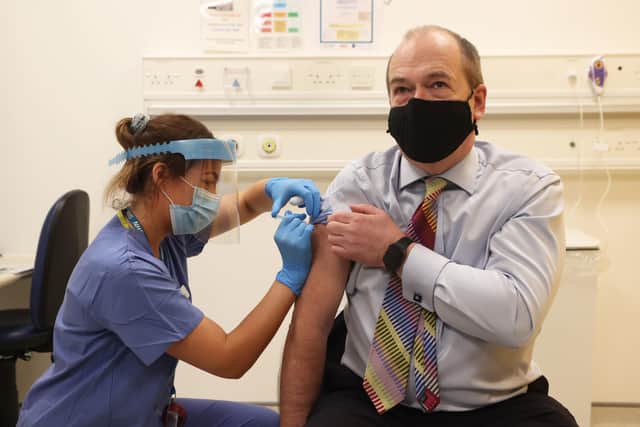 Northern Ireland Chief Medical Officer Michael McBride receives his second dose of the Oxford/AstraZeneca coronavirus vaccine from Nurse Alana McCaffery at the Ulster Hospital Covid-19 vaccination centre in Belfast