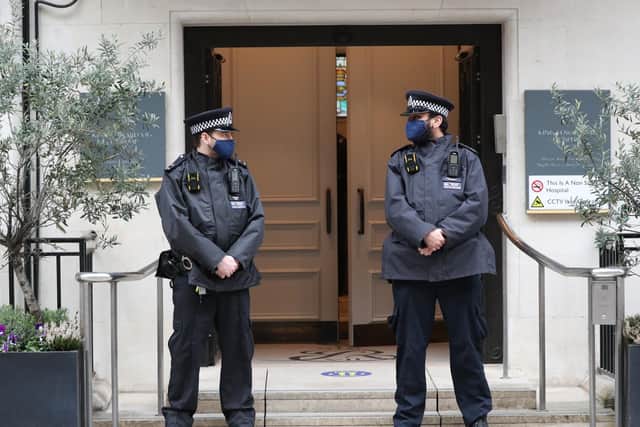 Police officers outside King Edward VII's Hospital, London, where the Duke of Edinburgh was moved for continuing treatment after his heart surgery at St Bartholomew's Hospital.