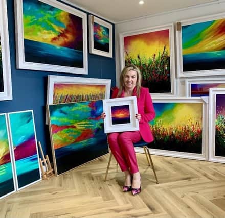 Jacqueline Rooney with some of her artwork