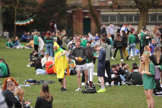 A man in a banana costume with people out in the Botanic Gardens in Belfast, on St Patrick's Day. Picture date: Wednesday March 17, 2021. PA Photo. See PA story ULSTER Coronavirus. Photo credit should read: Niall Carson/PA Wire