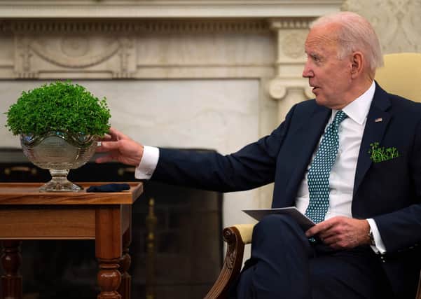 US President Joe Biden, pictured in the Oval Office on St Patrick’s Day with a bowl of Shamrock flown to Washington by the Irish government. Photo: Jim Watson/AFP via Getty