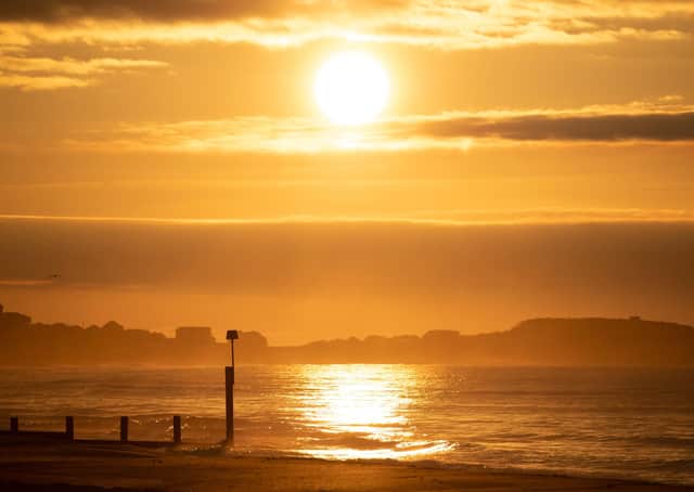 The sun rises over Boscombe beach in Dorset on the day of the Spring equinox this morning.  The worst of lockdown in short dark days is over. Photo: Andrew Matthews/PA Wire