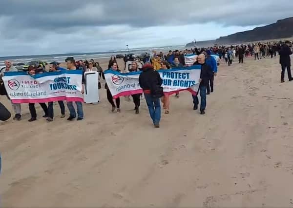 Screengrab taken from video posted by 'Freedom Alliance Island of Ireland' showing scenes from the anti-lockdown protest at Benone beach, Co Londonderry