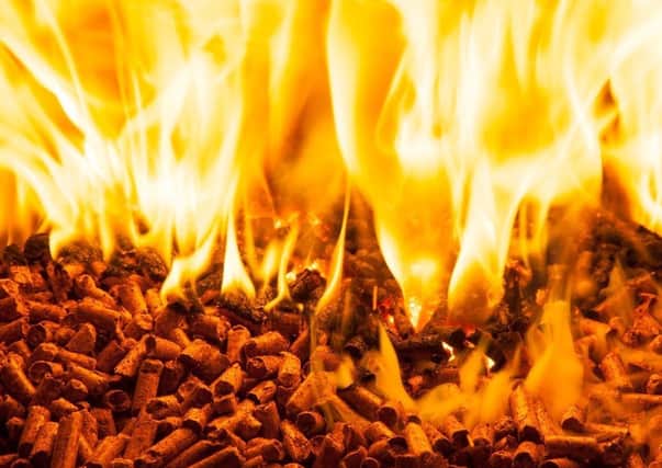 Burning wood pellets used in renewable heat. Tom Forgrave writes: "We now know the reasons used to collapse Stormont four years ago were unfounded. The renewable heat incentive scheme had successes such as helping reduce Co2 emissions by 7% across Northern Ireland"