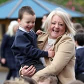 Diane Dawson, principal of  Braniel Primary School in Belfast welcomes Theodore McArthur-Collen back to class this morning after the lockdown break.
PICTURE BY STEPHEN DAVISON