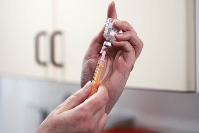 Advanced nurse practitioner prepares a dose of the AstraZeneca/Oxford Covid-19 vaccine