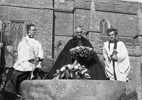 The Dean of Down, the Very Reverend J H R Good lays a wreath on St Patrick's Grave at Downpatrick, Co Down, with Canon Mervyn Kingston, left, and Stranmillis College chaplain Peter Cook on St Patrick's Day in March 1982. Pictures: Trevor Dickson/News Letter archives