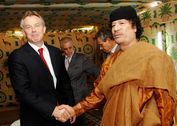 Former Prime Minister Tony Blair meeting Libyan leader Colonel Muammar Gaddafi at his desert base outside Sirte south of Tripoli in 2007. Photo: Stefan Rousseau/PA Wire