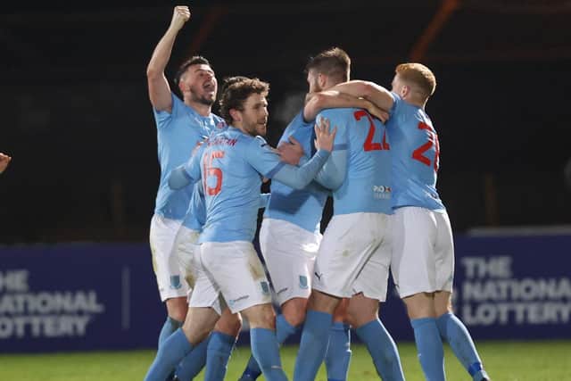 Ballymena United’s Conor Keeley is mobbed by his team-mates after his late winner against Linfield