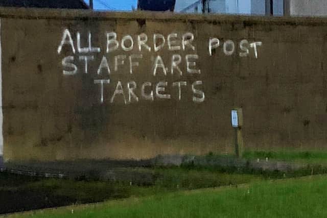 Graffiti had described all staff conducting Irish Sea border checks as ‘targets’ – but only 15% of them were withdrawn by Edwin Poots