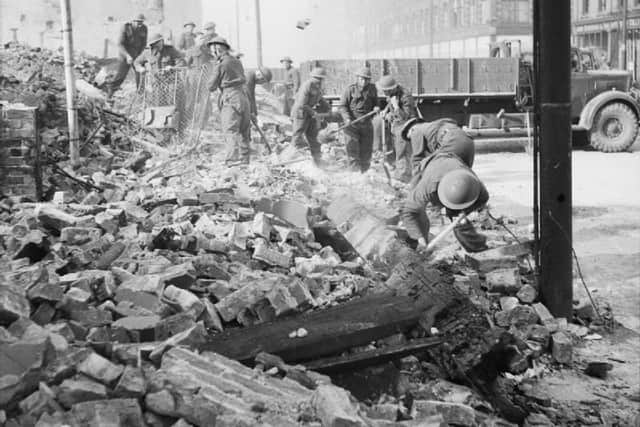 Soldiers clearing bomb damage during the blitz in Belfast